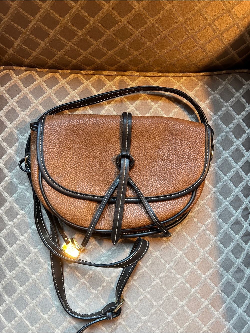 London Fog Brown Leather Crossbody Saddle Bag with Black Trim